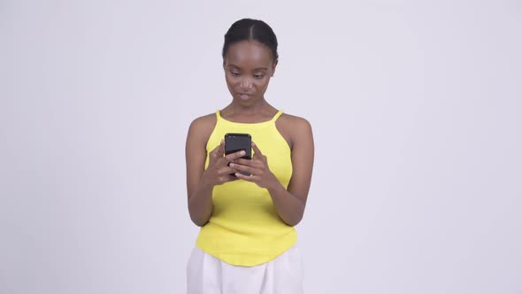 Young Beautiful African Woman Using Phone