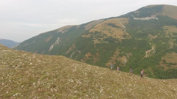 Group of four friends hiking in Umbria, Italy