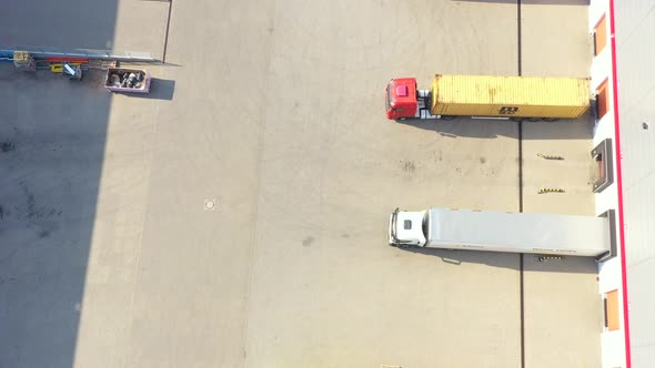 Aerial view of goods warehouse. Logistics center in industrial city zone from above. Aerial view of