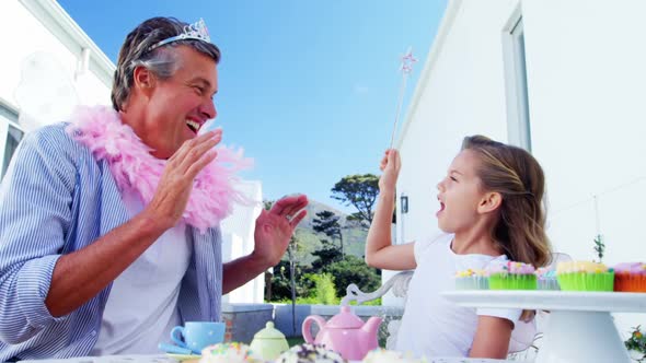 Daughter and father in fairy costume having fun 4k