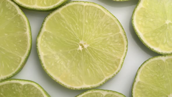 Lime Slices Closeup, Macro Food Summer Background, Fruits Top View. Rotate