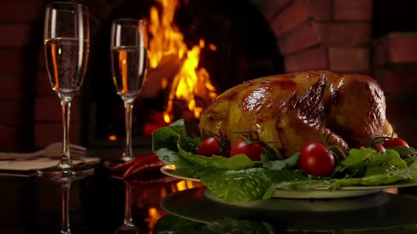 Hands Put a Dish with Chicken on a Table