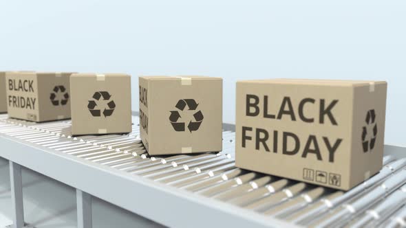 Boxes with BLACK FRIDAY Text on Roller Conveyor