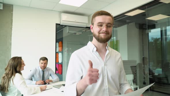 Portrait of a Confident Young Employee in the Office