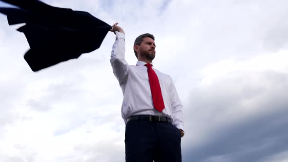 Successful Guy Manager Holding Fashion Business Suit on Sky Background Business Success