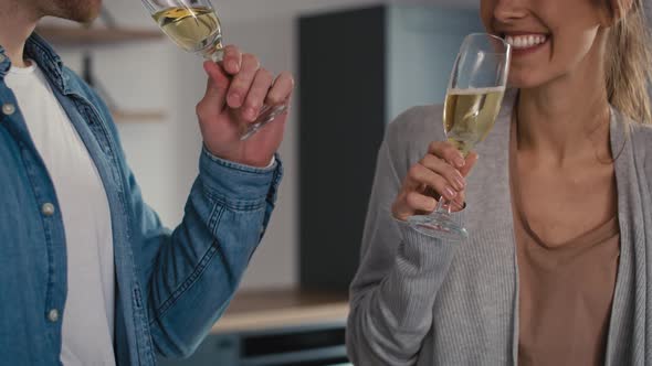 Couple celebrating house ownership with a champagne. Shot with RED helium camera in 8K.