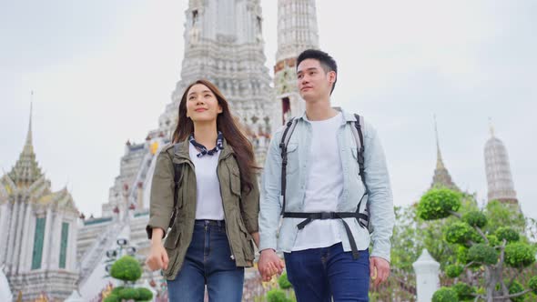Asian attractive romantic couple travel in the city for honeymoon trip.