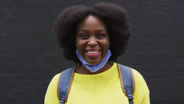 Portrait of african american wearing face mask in street