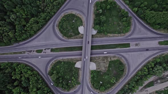 Aerial View of Road Junction with Moving Cars