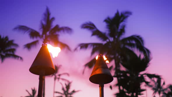 Cinematic Sunset at Tropical Island  Travel Tiki Torches with Bright Flames