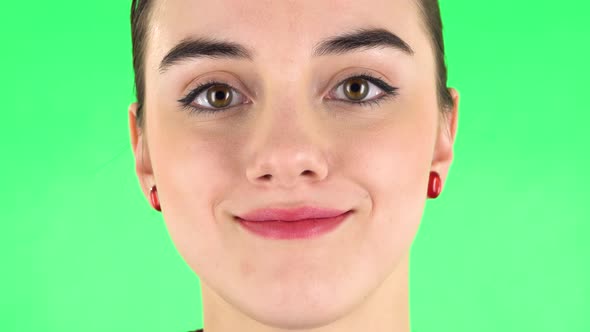 Woman Looking Straight and Smiling. Close Up Macro Portrait