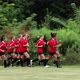 Girl soccer players running, one girl trails behind - VideoHive Item for Sale