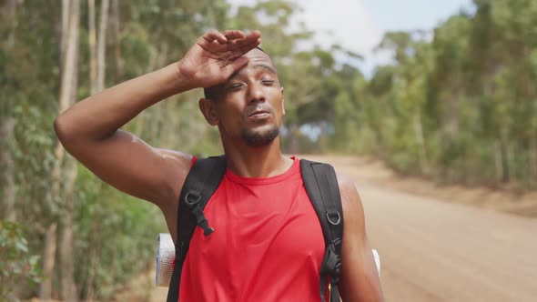 Sporty mixed race man with prosthetic leg hiking