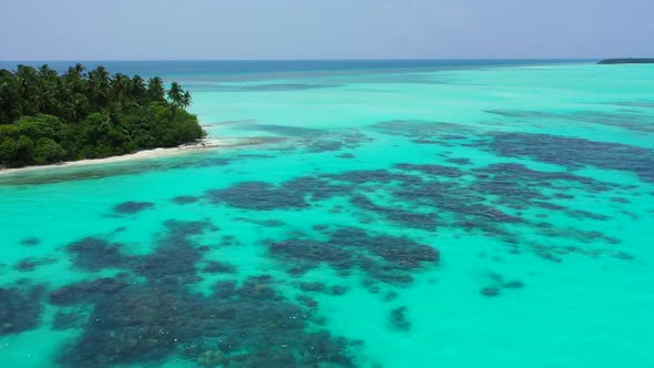 Aerial flying over landscape of paradise shore beach trip by blue sea with white sandy background of