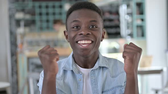 Excited African Man Celebrating Success