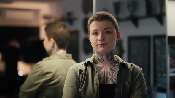 Portrait of young adult owner of tattoo salon. Shot with RED helium camera in 8K.