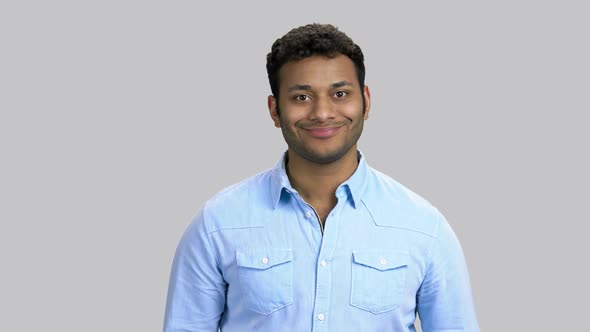 Portrait of Cheerful Darkskinned Man Wearing Blue Shirt