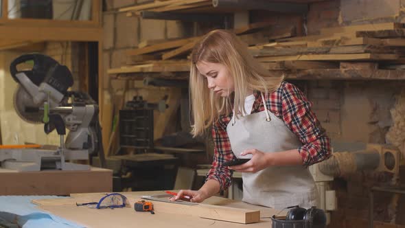 Professional Carpenter with Mobile Phone