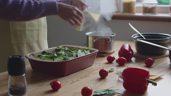 Woman Is Putting Hot Noodles In Baking Dish