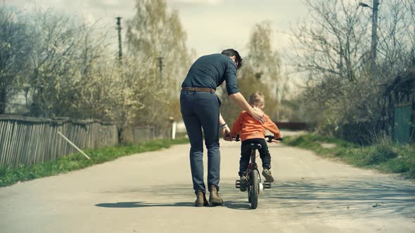 Little Kid Having Fun.  Carefree Dad With Preschool Son Cycling Enjoy Activity Adventure.