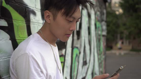 Portrait of a Modern Urban Teen with a Smartphone