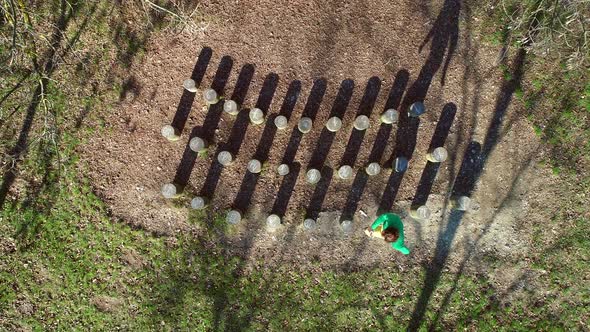 Aerial view of man jumping over wooden stumps, Zagreb, Croatia.