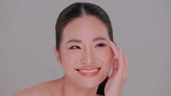 Portrait of Asian young woman with soft make-up and white skin.
