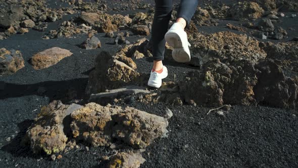 Closeup Shot of Woman Traveler Walks Through the Lava Field Around Chinyero Volcano in the Teide