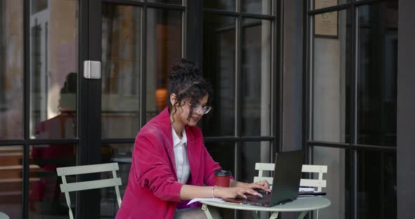 Young Freelancer Woman Work at the Cafe