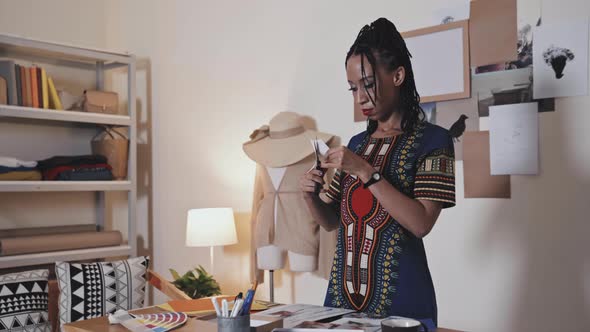 Female Designer Doing Paper Craft in Creative Studio