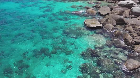 Sea Surface Ripple at Sunlight with Transparent Clear Water and Visible Sandy Bottom with Underwater