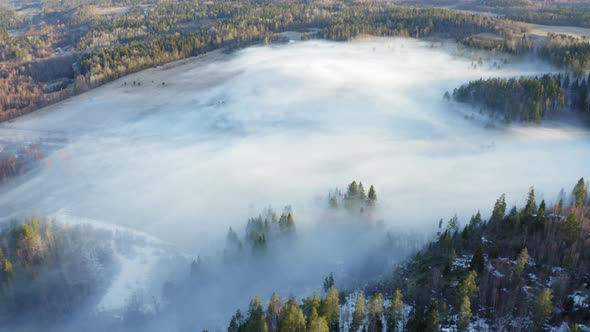 Foggy Sunrise Around Hills