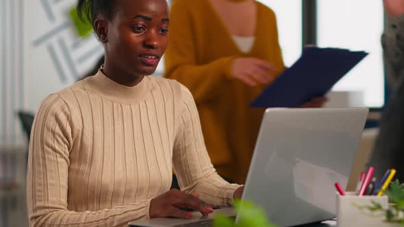 Portrait of Authentic African Business Woman Reading Good News on Laptop