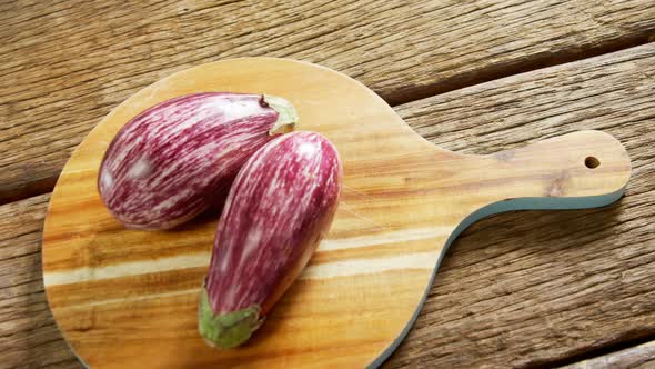 Two eggplant on chopping board 4k