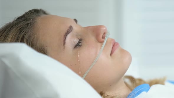 Sad Crying Woman With Nasal Cannula Lying Hospital Bed, Disease Hopelessness