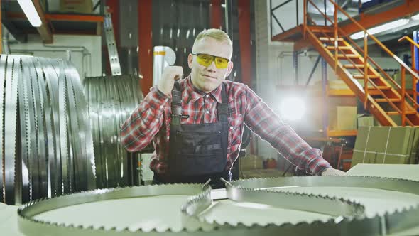 Happy Worker in the Uniform and Wearing Glasses