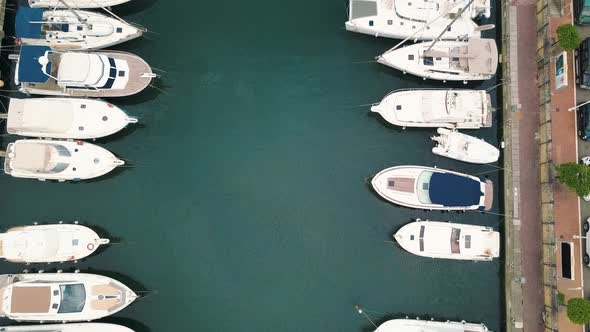 Aerial View on Moored White Sailing Yachts, Catamarans and Boats at Portorosa, Furnari, Italy