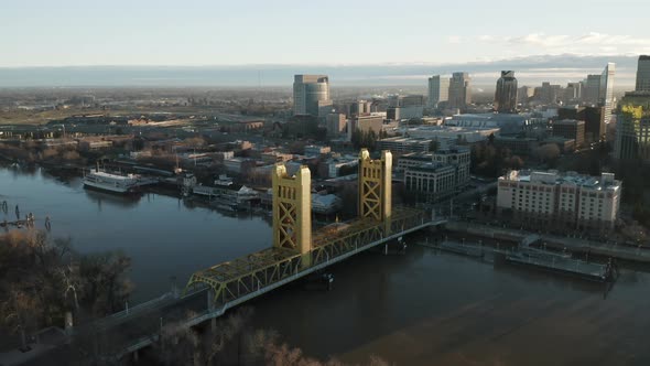 Aerial drone right parallax of Tower Bridge and Downtown Sacramento, CA, including Old Sacramento &