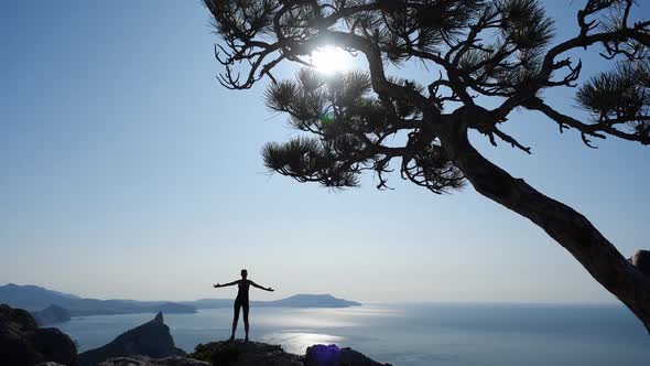 Female Tourist Athlete Climbed To the Top of High Mountain in Crimea. Young Woman Enjoys Beautiful