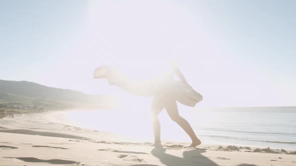 Beautiful Blond Woman In Gold On Sunny Beach