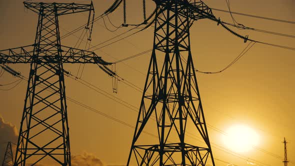 Time Lapse of Electricity High Voltage Pylon in USA at Sunset