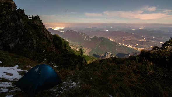 Camping in Mountains under Night Sky with Moonlight