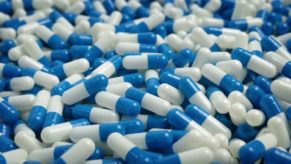 Moving Past Pile Of Medicine Capsules