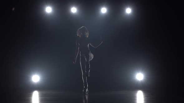 Woman in Sports Suit Doing Exercises in Kangoo Jumps Shoes