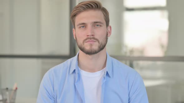 Portrait of Young Creative Man Looking at Camera