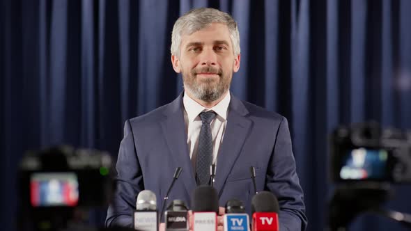 Portrait of Cheerful Politician at Press Conference