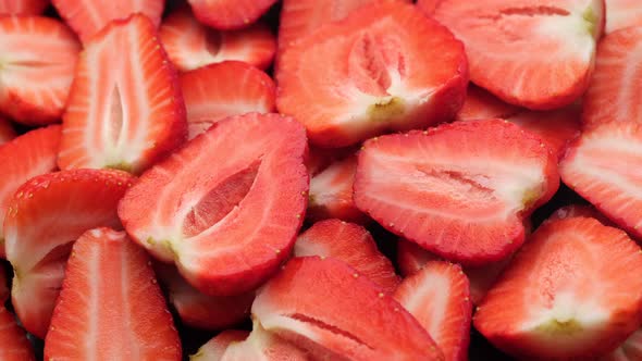 sliced fresh strawberry close up, rotate. Summer Dessert. 4K UHD video