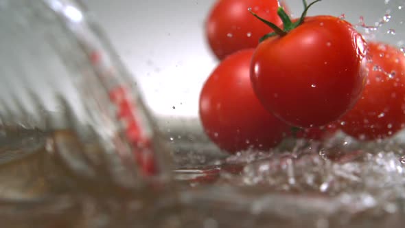 Tomato with water splash, Slow Motion