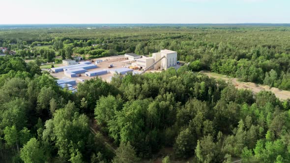 Aerial View of Small Modern Brick Factory in the Green Forest in Summer