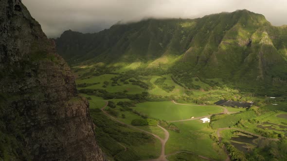 Drone Aerial Cliffside Reveal onto Kualoa Ranch. Oahu, Hawaii